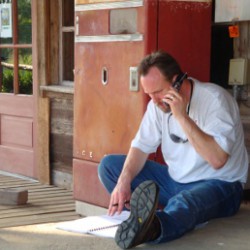 Man with Phone and Notes